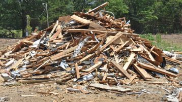 Pile of broken boards and after demolition services by We Love Junk in Philadelphia