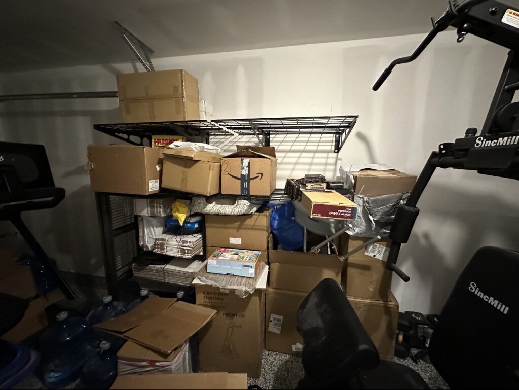 Cluttered garage filled with boxes and household items